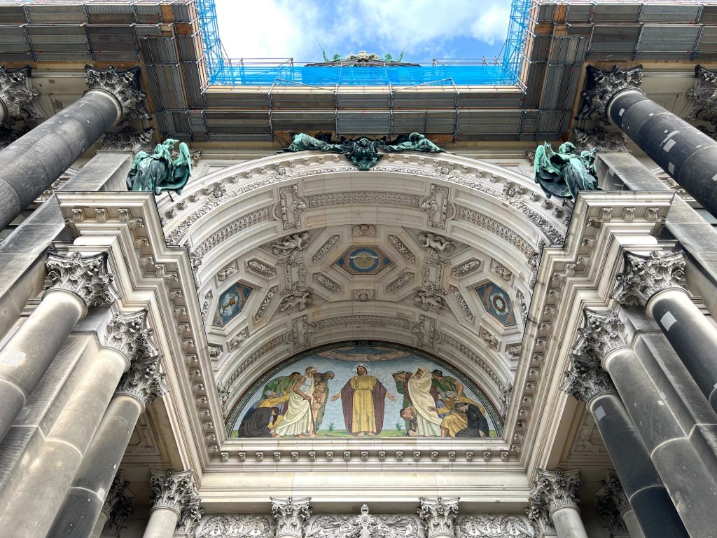 Street photography in Berlin. Photo of people a design on the inside of a cathedral. Architecture and design details. 