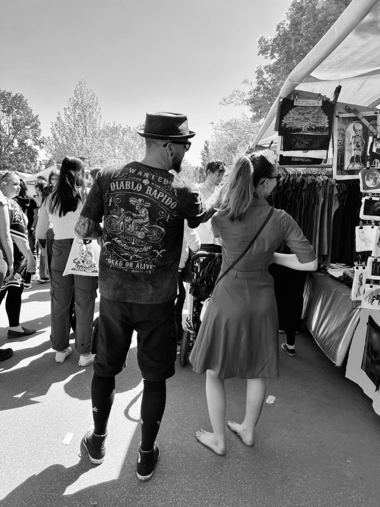 Street photography in Berlin. Photo of people in a market. Black and white photo. 