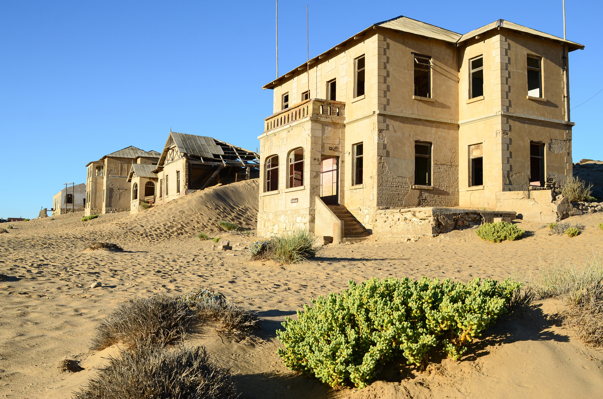 "Portraits of Time" Fine Art Photography Collection. Kolmanskop, Namibia. A work from the collection created at Kolmanskop by photographer, Lizane Louw. An image of an abandoned building in the diamond mining village in the Namib.